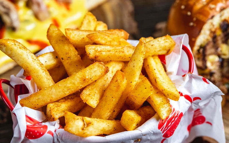 Side view French fries with seasoning